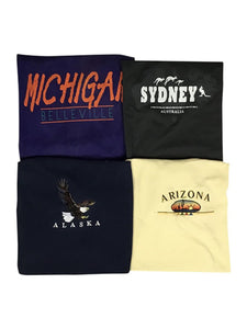 An image of four different vintage t-shirts with destination names 